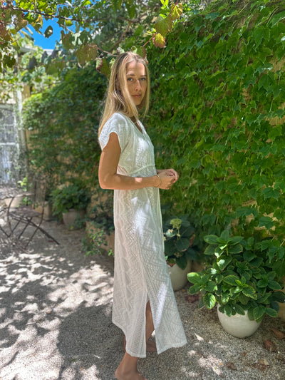 Iridescent Sea Fremantle Indulge in the art of summer with our Antibes Embroidered Cotton Dress. Made from breezy cotton, this dress is perfect for warm weather days. Embrace the season in style with its elegant vine embroidery.