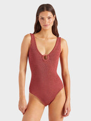 Woman wearing a red swimsuit on a white background HUNZA G Coverage Celine Swimsuit in Rosewood Iridescent Sea Fremantle