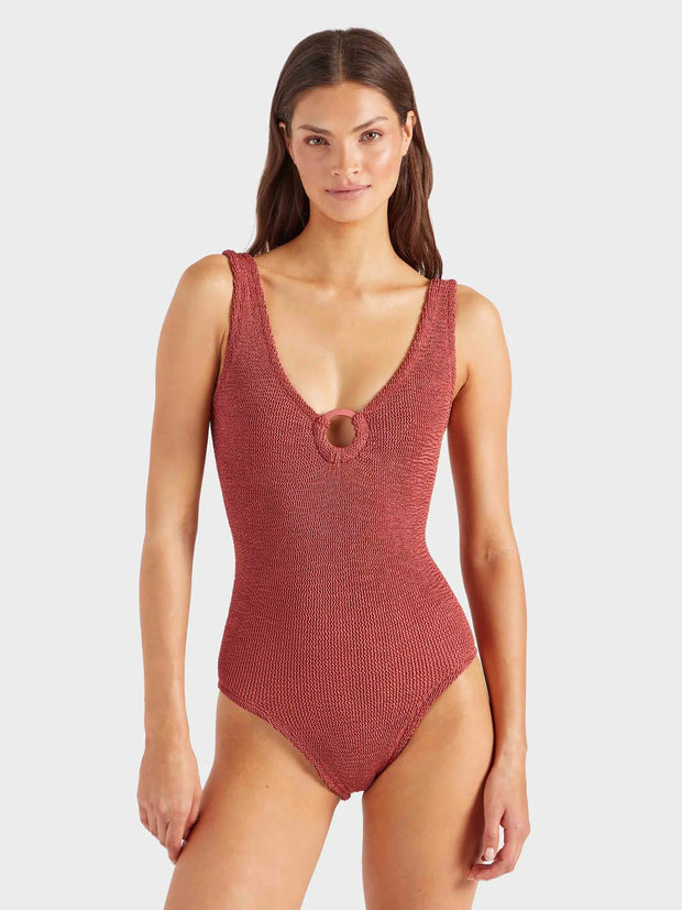 Woman wearing a red swimsuit on a white background HUNZA G Coverage Celine Swimsuit in Rosewood Iridescent Sea Fremantle
