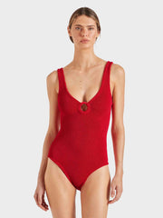 Woman wearing a red swimsuit on a white background HUNZA G Coverage Celine Swimsuit in Red iridescent Sea Fremantle