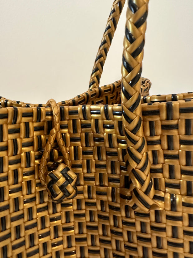 Carry your beach essentials in style with this Black and Gold Basket. Made of durable plastic, it's perfect for a day at the beach. No more messy totes, this sturdy basket is a must-have for any beach trip. Can also double as a chic market tote. Iridescent sea South Fremantle