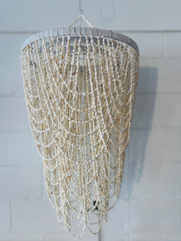 A truly exceptional piece, these chandeliers are hand made using hundreds of tiny white shells twined together on a wrought iron base. Iridescent sea Perth Fremantle