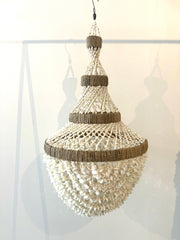 A truly exceptional piece, these chandeliers are hand made using hundreds of tiny white shells twined together on a wrought iron base. Iridescent sea Perth Fremantle