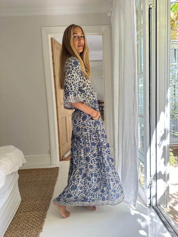 Iridescent Sea's 'Sahana' dress is cut from breezy silk-habotai patterned with striking silver and blue floral design created using traditional woodblock printing techniques. Iridescent Sea Fremantle