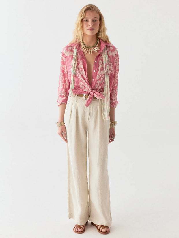 Woman wearing a pink checkered shirt and beige pants on a white background MAISON HOTEL Rusty Blouse in Pink Floyd Iridescent Sea Fremantle