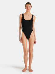 Woman wearing a white swimsuit against a plain background HUNZA G Square Neck Swimsuit in Black Iridescent Sea Fremantle