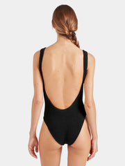 Woman wearing a white swimsuit against a plain background HUNZA G Square Neck Swimsuit in Black Iridescent Sea Fremantle