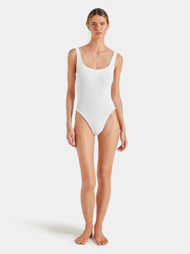 Woman wearing a white swimsuit against a plain background HUNZA G Square Neck Swimsuit in White Iridescent Sea Fremantle