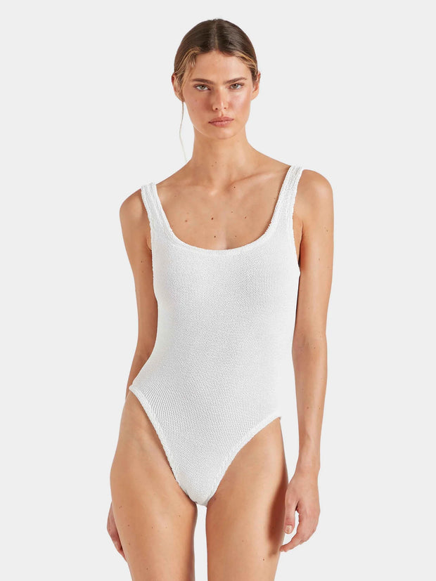 Woman wearing a white swimsuit against a plain background HUNZA G Square Neck Swimsuit in White Iridescent Sea Fremantle