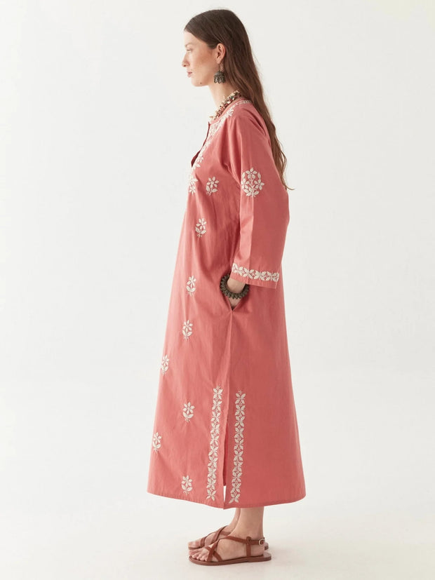 Woman wearing a pink embroidered dress on a white background MAISON HOTEL Anbu Dress - Chikan Corallo Iridescent sea Fremantle Perth