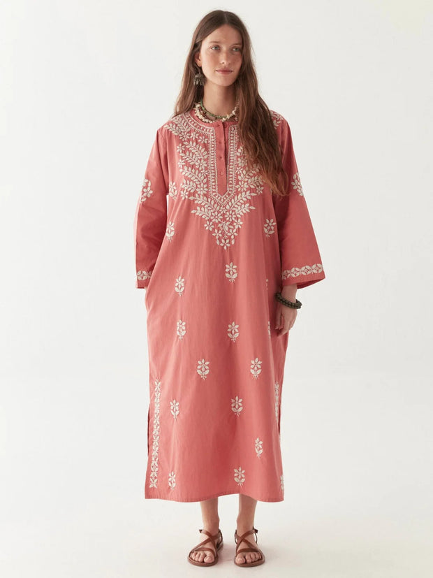 Woman wearing a pink embroidered dress on a white background MAISON HOTEL Anbu Dress - Chikan Corallo Iridescent sea Fremantle Perth