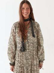 Woman wearing a long, patterned dress on a white background MAISON HOTEL Antonia Dress in White Lies Iridescent Sea Perth Fremantle
