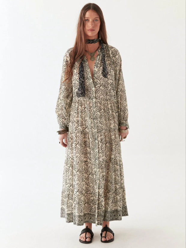 Woman wearing a long, patterned dress on a white background MAISON HOTEL Antonia Dress in White Lies Iridescent Sea Perth Fremantle