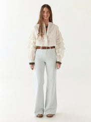 Brown woven belt with a silver buckle on a multicolored textured fabric background MAISON HOTEL Devendra Belt -  James Brown Iridescent Sea Fremantle Perth