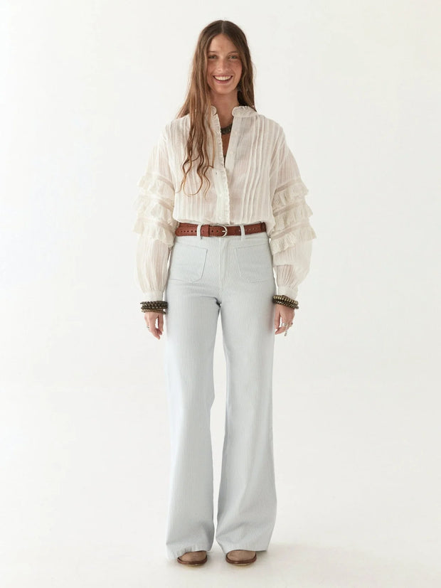 Brown woven belt with a silver buckle on a multicolored textured fabric background MAISON HOTEL Devendra Belt -  James Brown Iridescent Sea Fremantle Perth