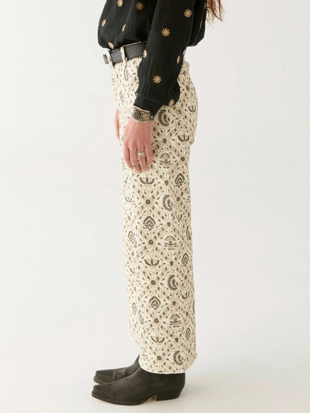 Person wearing a black shirt and patterned pants on a white background MAISON HOTEL Lula Pant in Java Vanilla Iridescent sea Perth Fremantle